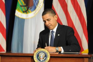 President Barack Obama signs a Memorandum of Understanding