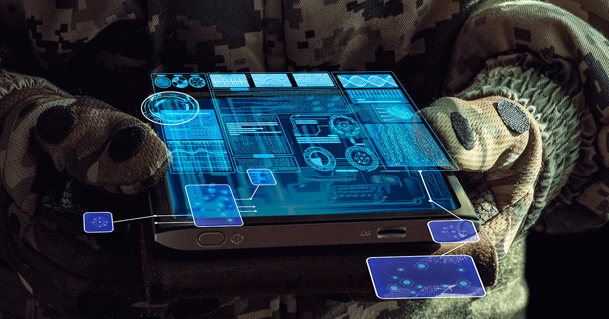 Closeup of a soldier holding a tablet showing a visual representation of an AI tool analyzing battlefield data
